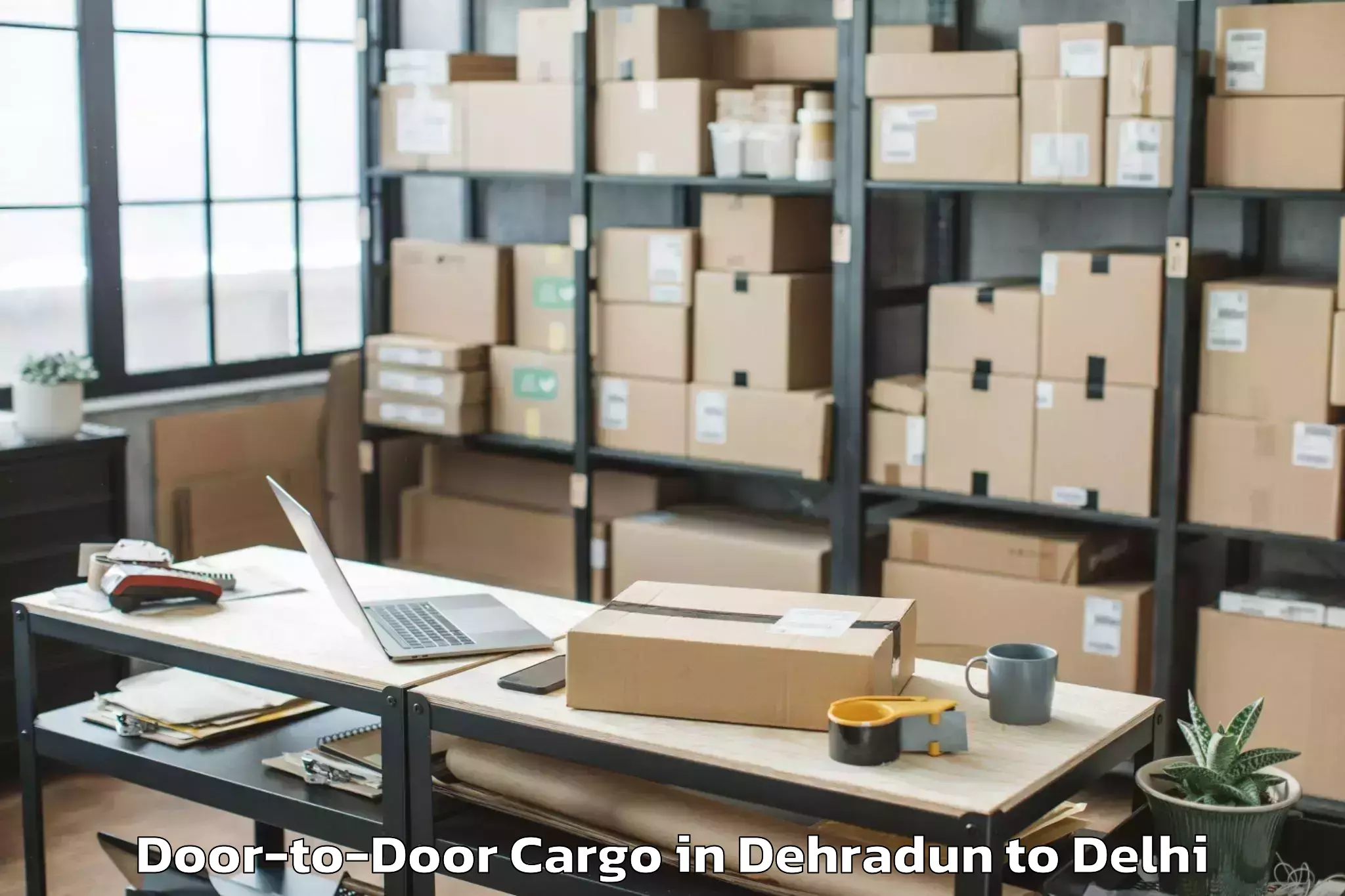 Get Dehradun to Defence Colony Door To Door Cargo